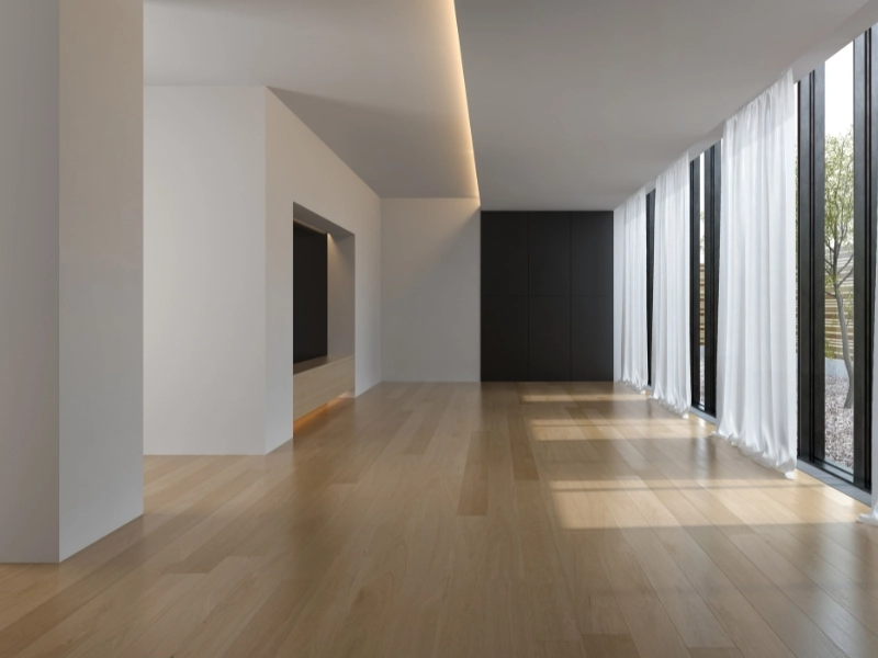 Modern minimalist showroom interior with white gypsum ceilings and natural light – contact GypsumWorks Malta