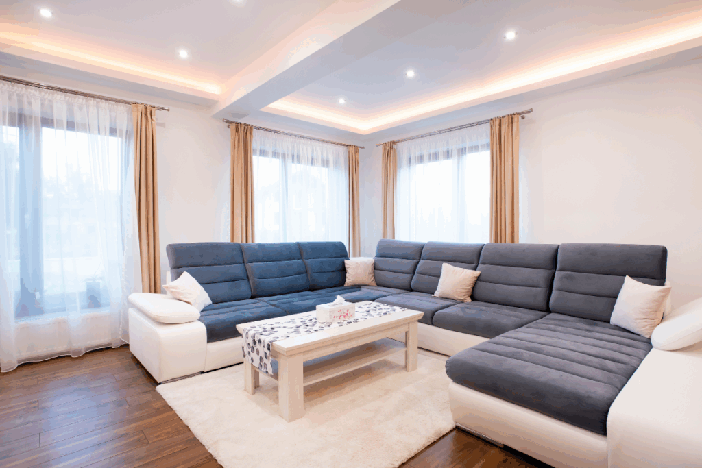 Modern gypsum ceiling with integrated LED lighting in a bright living room